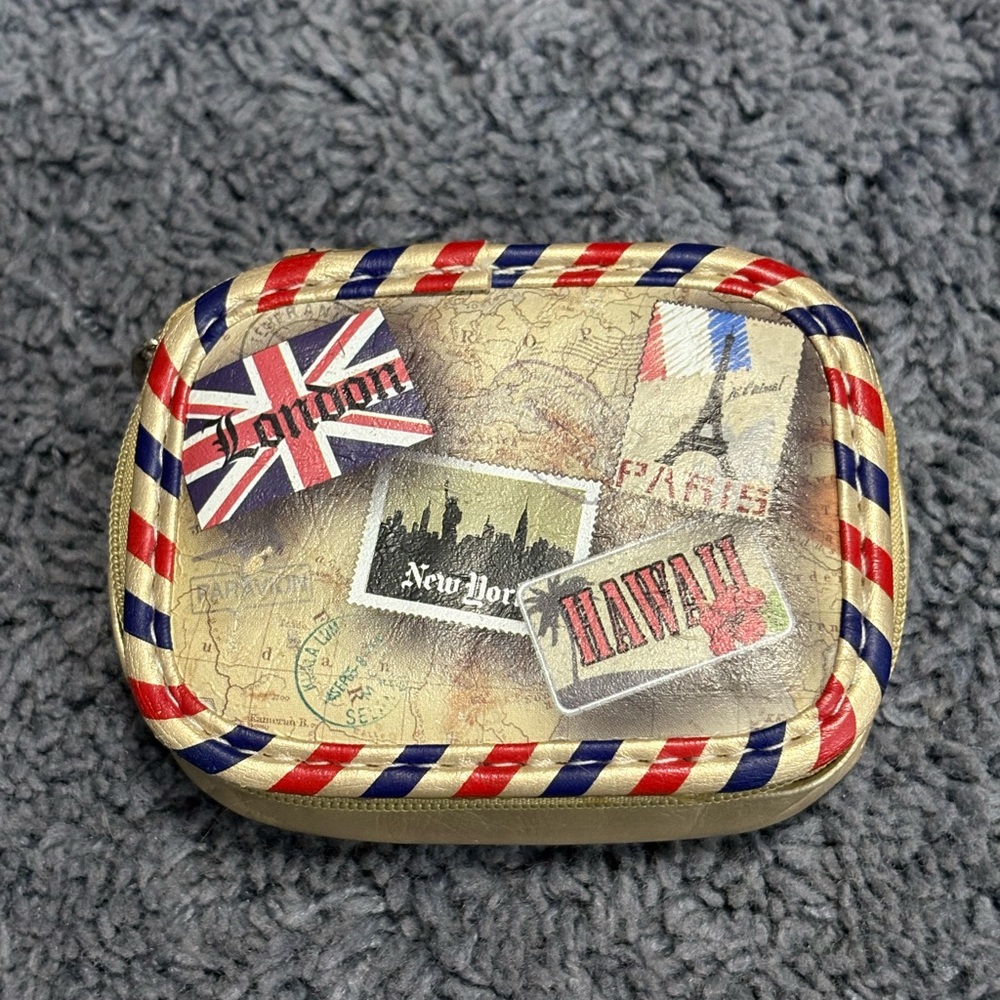 NWOT small pouch with different travel destinations on the front